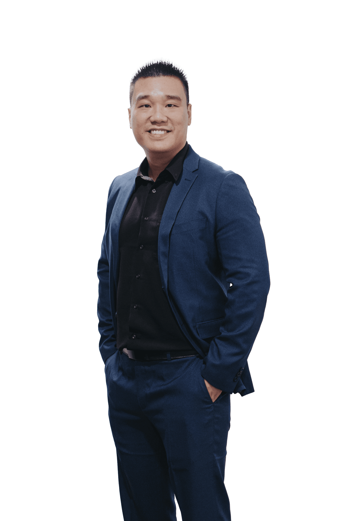 Portrait of Daniel Lim smiling in a navy suit and black shirt